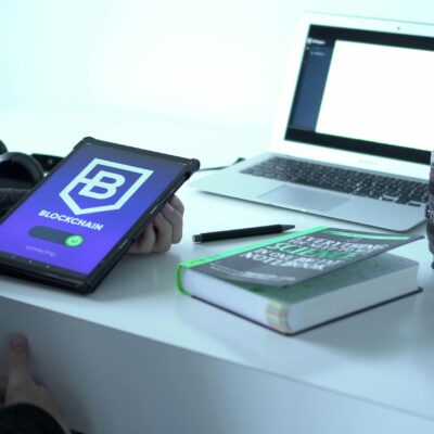Black and White Laptop Computer Beside Black Headphones